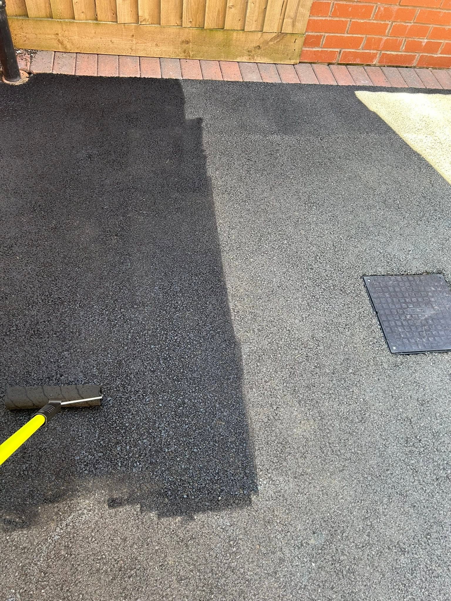 Tarmac restoration coating being applied by Top Gun & Son